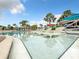 Relaxing pool area with lounge chairs and access to pool at 826 Paradise Dr, Davenport, FL 33897