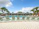 Resort-style pool with numerous lounge chairs at 826 Paradise Dr, Davenport, FL 33897