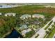Aerial view of community surrounded by trees at 9051 Treasure Trove Ln # 102, Kissimmee, FL 34747