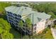 Aerial shot of the condo complex surrounded by trees at 9051 Treasure Trove Ln # 102, Kissimmee, FL 34747