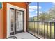 Screened balcony with French doors, community views, and a seating area at 9051 Treasure Trove Ln # 102, Kissimmee, FL 34747