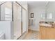 Large bathroom with separate shower, corner tub, and double vanity at 9051 Treasure Trove Ln # 102, Kissimmee, FL 34747