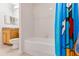 Clean bathroom with shower/tub combo, single vanity, and toilet at 9051 Treasure Trove Ln # 102, Kissimmee, FL 34747