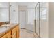 Bathroom with vanity, soaking tub, and glass-enclosed shower at 9051 Treasure Trove Ln # 102, Kissimmee, FL 34747