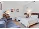 Cozy bedroom furnished with twin beds and a small sitting area at 9051 Treasure Trove Ln # 102, Kissimmee, FL 34747
