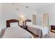 This bedroom offers two twin beds, nightstands, and access to a nearby bathroom at 9051 Treasure Trove Ln # 102, Kissimmee, FL 34747