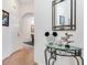 Hallway featuring a decorative table with Disney-themed accents at 9051 Treasure Trove Ln # 102, Kissimmee, FL 34747