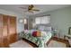 Tropical-themed bedroom with wood floors, ceiling fan, and closet at 1130 Jacaranda Ave, Daytona Beach, FL 32118