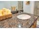 Close-up of bathroom vanity with granite countertop and modern fixtures at 150 E Robinson St # 2801, Orlando, FL 32801