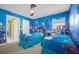 Vibrant Finding Nemo themed bedroom featuring two twin beds and playful decor at 1528 Mulligan Blvd, Davenport, FL 33896