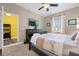 Inviting bedroom with a king-size bed, dresser, and a view from the window at 1528 Mulligan Blvd, Davenport, FL 33896