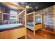 Themed bedroom with two canopy beds, library wallpaper, and wood floors at 1528 Mulligan Blvd, Davenport, FL 33896