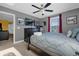 Spacious bedroom with a king-sized bed, ceiling fan, and a TV at 1528 Mulligan Blvd, Davenport, FL 33896
