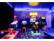 Game room featuring Batman-themed arcade games and pinball machines at 1528 Mulligan Blvd, Davenport, FL 33896