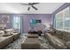 Spacious living area with comfortable seating, a ceiling fan, and decorative accents at 1528 Mulligan Blvd, Davenport, FL 33896