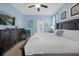 Inviting main bedroom with king bed, crib, and direct access to a private patio at 1528 Mulligan Blvd, Davenport, FL 33896
