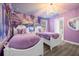 Frozen-themed bedroom with two twin beds, a chandelier, and purple walls at 1530 Moon Valley Dr, Davenport, FL 33896