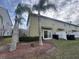 Landscaped backyard with tropical plants and trees at 1939 Chatham Place Dr, Orlando, FL 32824