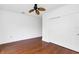 Spacious bedroom with hardwood floors, ceiling fan, and double closet doors at 234 N Glenwood Ave # 4, Orlando, FL 32803
