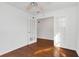 Empty room with hardwood floors, white walls, a ceiling fan, and French doors at 234 N Glenwood Ave # 4, Orlando, FL 32803