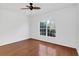 Empty bedroom with hardwood floors, ceiling fan, and large window at 234 N Glenwood Ave # 4, Orlando, FL 32803