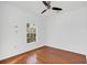 Bright bedroom with hardwood floors, ceiling fan, and window at 234 N Glenwood Ave # 4, Orlando, FL 32803