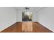 Spacious bedroom with polished hardwood floors, white walls, and a sliding glass door leading to a balcony at 234 N Glenwood Ave # 4, Orlando, FL 32803