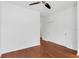 Empty bedroom with double closet doors, hardwood floors, and ceiling fan at 234 N Glenwood Ave # 4, Orlando, FL 32803