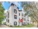 Exterior view of white townhomes with a 