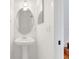 Half bathroom with pedestal sink and oval mirror at 234 N Glenwood Ave # 4, Orlando, FL 32803