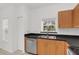 Functional kitchen with stainless steel appliances and wood cabinetry at 234 N Glenwood Ave # 4, Orlando, FL 32803