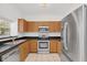 Well-equipped kitchen with stainless steel appliances and wood cabinetry at 234 N Glenwood Ave # 4, Orlando, FL 32803