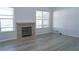 Spacious living room with fireplace and wood-look floors at 4915 Labrador Ln, Orlando, FL 32818