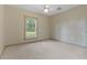 Empty bedroom with neutral walls, carpet, and a window at 502 N Noel Ct, Chuluota, FL 32766