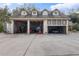 View of the interior of a garage with tools, equipment, and a car at 502 N Noel Ct, Chuluota, FL 32766