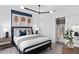 Stylish bedroom with a modern bed, nightstands, and a walk-in closet at 5040 Oak Seed Way, St Cloud, FL 34771