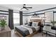 A cozy bedroom with car-themed decor and large window, perfect for or teenagers at 5040 Oak Seed Way, St Cloud, FL 34771