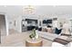 Open-concept living area with a modern kitchen, dining space, and comfortable seating at 5040 Oak Seed Way, St Cloud, FL 34771