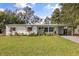 Charming single-story home with a landscaped front yard and covered entryway at 5404 Milan Dr, Orlando, FL 32810