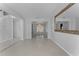 Dining room with tile floors, chandelier lighting, and a large decorative mirror at 6019 Bay Valley Ct, Orlando, FL 32819