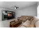 Living Room with couch, entertainment center, and tiled flooring at 6019 Bay Valley Ct, Orlando, FL 32819