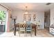 Charming dining area with a wooden table and colorful chairs at 6510 Corona Dr, Orlando, FL 32810