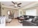 Living room with a sectional sofa, ceiling fan, and decorative accents at 6510 Corona Dr, Orlando, FL 32810