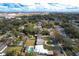 Aerial view of a house with a pool in a residential area at 1013 Carlson Dr, Orlando, FL 32804