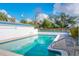 Sparkling blue pool with surrounding patio and landscaping at 1013 Carlson Dr, Orlando, FL 32804