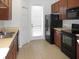 Bright, eat-in kitchen with tile flooring and black appliances at 11749 Fitzgerald Butler Rd, Orlando, FL 32836