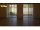 Empty dining room with tiled floors and sliding glass doors to backyard at 15271 Willow Arbor Cir, Orlando, FL 32824