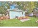 Cozy backyard patio with seating area and grill, perfect for outdoor entertaining at 1550 Indiana Ave, Winter Park, FL 32789