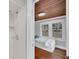 Bathroom with marble vanity, subway tile shower, and classic bathtub at 1550 Indiana Ave, Winter Park, FL 32789