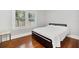 Bright bedroom featuring hardwood floors and ample natural light at 1550 Indiana Ave, Winter Park, FL 32789
